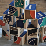 Uncle Goose Wooden Blocks, one side of each block reveals a feathery close up of the bird featured on its opposite side.